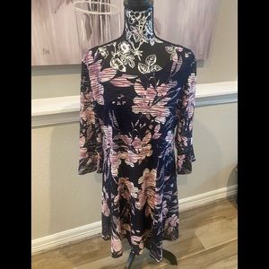 Lovely navy and pink dress, Super stretch very flattering fit. Sheer sleeves